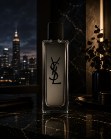 Yves Saint Laurent MYSLF Eau de Toilette luxury men's fragrance displayed on a marble surface with a modern city skyline and sophisticated evening ambiance