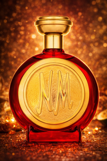 Boadicea The Victorious 1907 luxury niche perfume bottle with red glass and gold emblem on glowing gold background