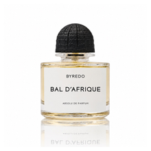 Byredo Bal d'Afrique Absolu de Parfum unisex fragrance bottle with golden amber liquid, white minimalist label and textured black cap on a white background