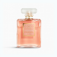Chanel Coco Mademoiselle Eau de Parfum bottle with peach-pink fragrance liquid and frosted cap on a plain white background