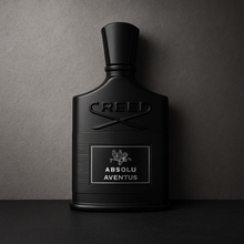 Creed Absolu Aventus bottle with black-on-black packaging displayed against a textured grey background
