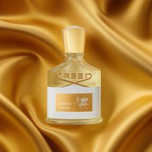 Creed Aventus for Her bottle with golden background - women's luxury perfume