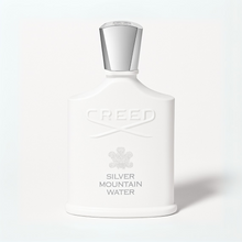 Creed Silver Mountain Water perfume bottle with silver cap and white bottle on a plain white background
