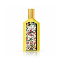 Gucci Flora Gorgeous Orchid Eau de Parfum bottle on a clean white background, showcasing the bright yellow bottle, gold cap, and signature Gucci Flora botanical design