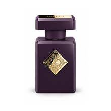 Initio Side Effect Eau de Parfum fragrance bottle with deep purple finish and ornate gold emblem on white background