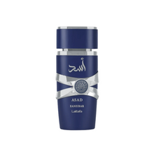 Lattafa Asad Zanzibar cologne bottle isolated on white background, featuring navy and chrome details with Arabic calligraphy