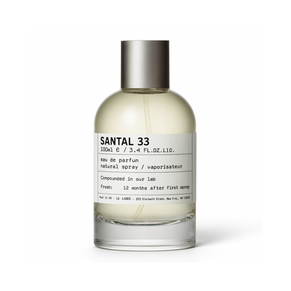 Le Labo Santal 33 perfume bottle with minimalist white label and silver cap on a plain white background