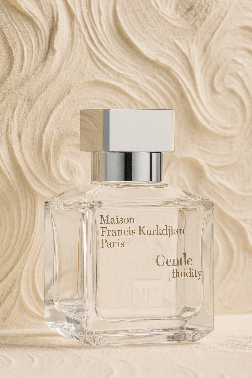 Maison Francis Kurkdjian Gentle Fluidity Silver perfume bottle displayed against a textured beige background