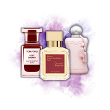 Tom Ford Lost Cherry, Baccarat Rouge 540, and Delina perfume bottles on a purple watercolor background