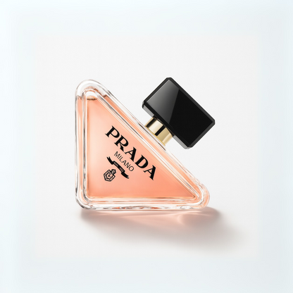 Prada Paradoxe Eau de Parfum triangular perfume bottle with black cap displayed on a white background