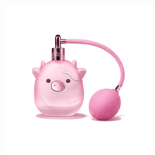 Squishmallow Pink Possibilities Eau de Parfum featuring pink pig-shaped bottle and bulb atomizer on white background