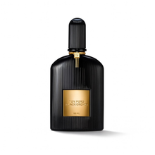 Tom Ford Black Orchid Eau de Parfum black ribbed bottle with gold label on a plain white background