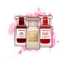 Tom Ford Lost Cherry, Vanilla Sex, and Electric Cherry bottles on a pink watercolor background
