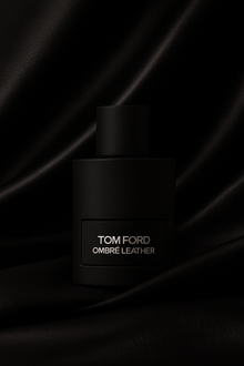 Tom Ford Ombre Leather Eau de Parfum black matte bottle displayed against textured black leather fabric background