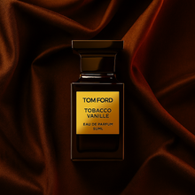 Tom Ford Tobacco Vanille Eau de Parfum bottle on luxurious dark brown satin background