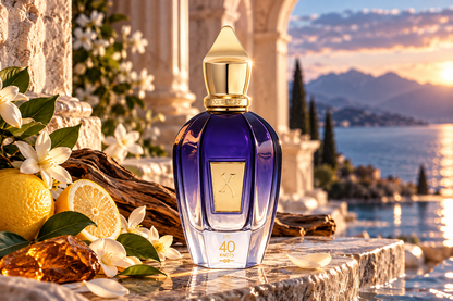 Xerjoff 40 Knots Eau de Parfum unisex fragrance bottle in a luxurious Mediterranean coastal sunset setting with deep blue glass, gold cap, fresh citrus, white blossoms, driftwood and elegant stone architecture