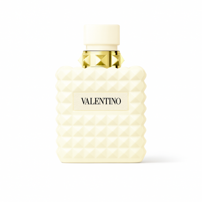 Valentino Donna Born in Roma Ivory perfume bottle with ivory studded design and gold accents on a plain white background