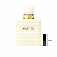 Valentino Donna Born in Roma Ivory perfume bottle with ivory studded design and gold accents on a plain white background