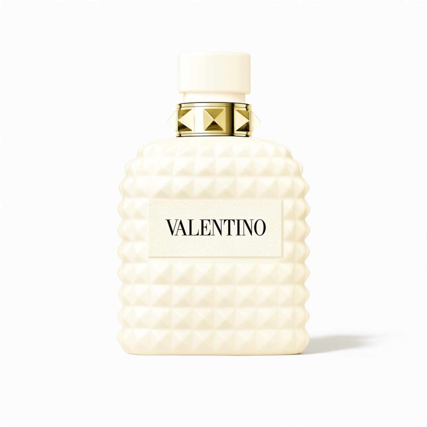 Valentino Uomo Born in Roma Ivory perfume bottle with ivory studded design and gold accents on a plain white background