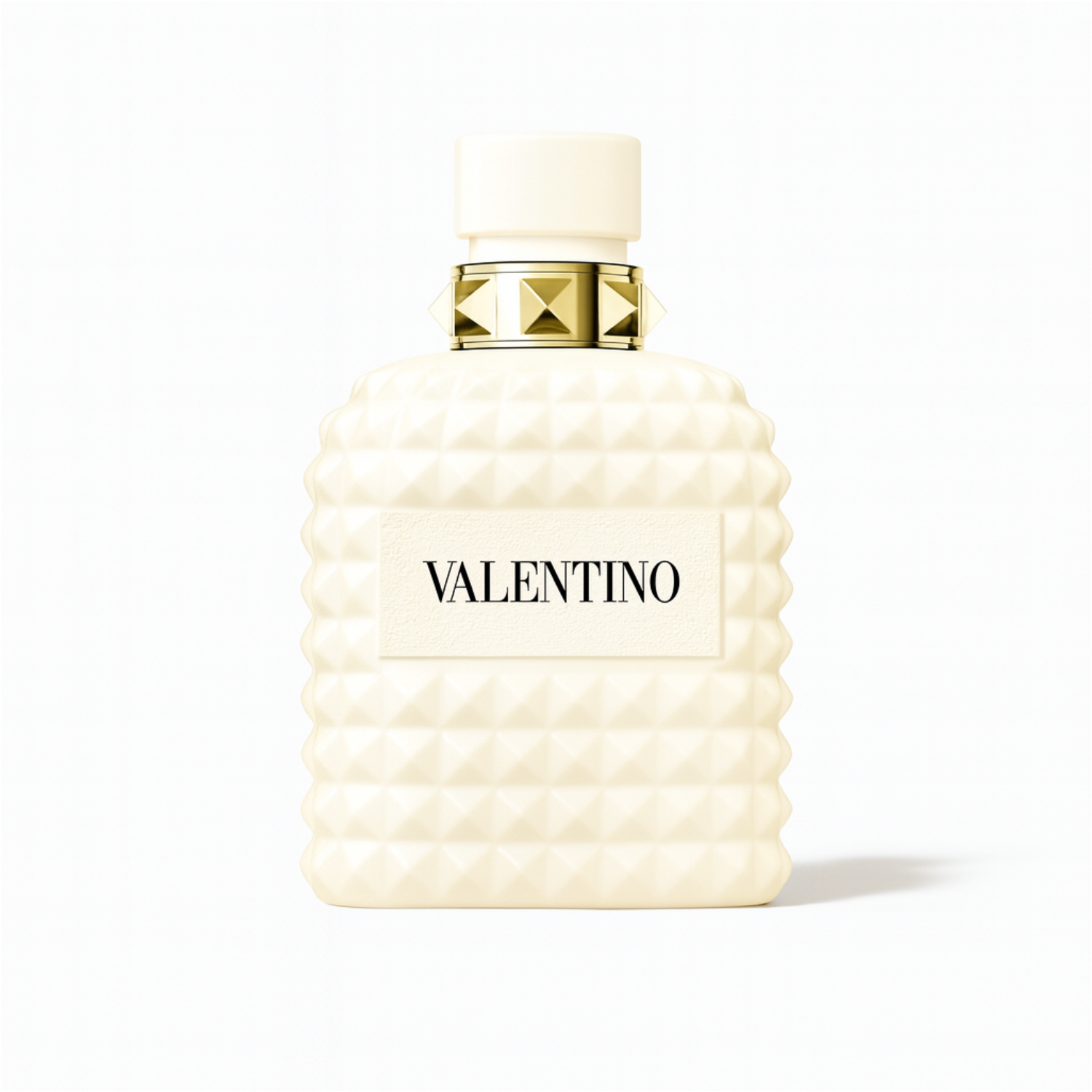Valentino Uomo Born in Roma Ivory perfume bottle with ivory studded design and gold accents on a plain white background