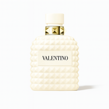 Valentino Uomo Born in Roma Ivory perfume bottle with ivory studded design and gold accents on a plain white background