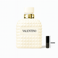 Valentino Uomo Born in Roma Ivory perfume bottle with ivory studded design and gold accents on a plain white background