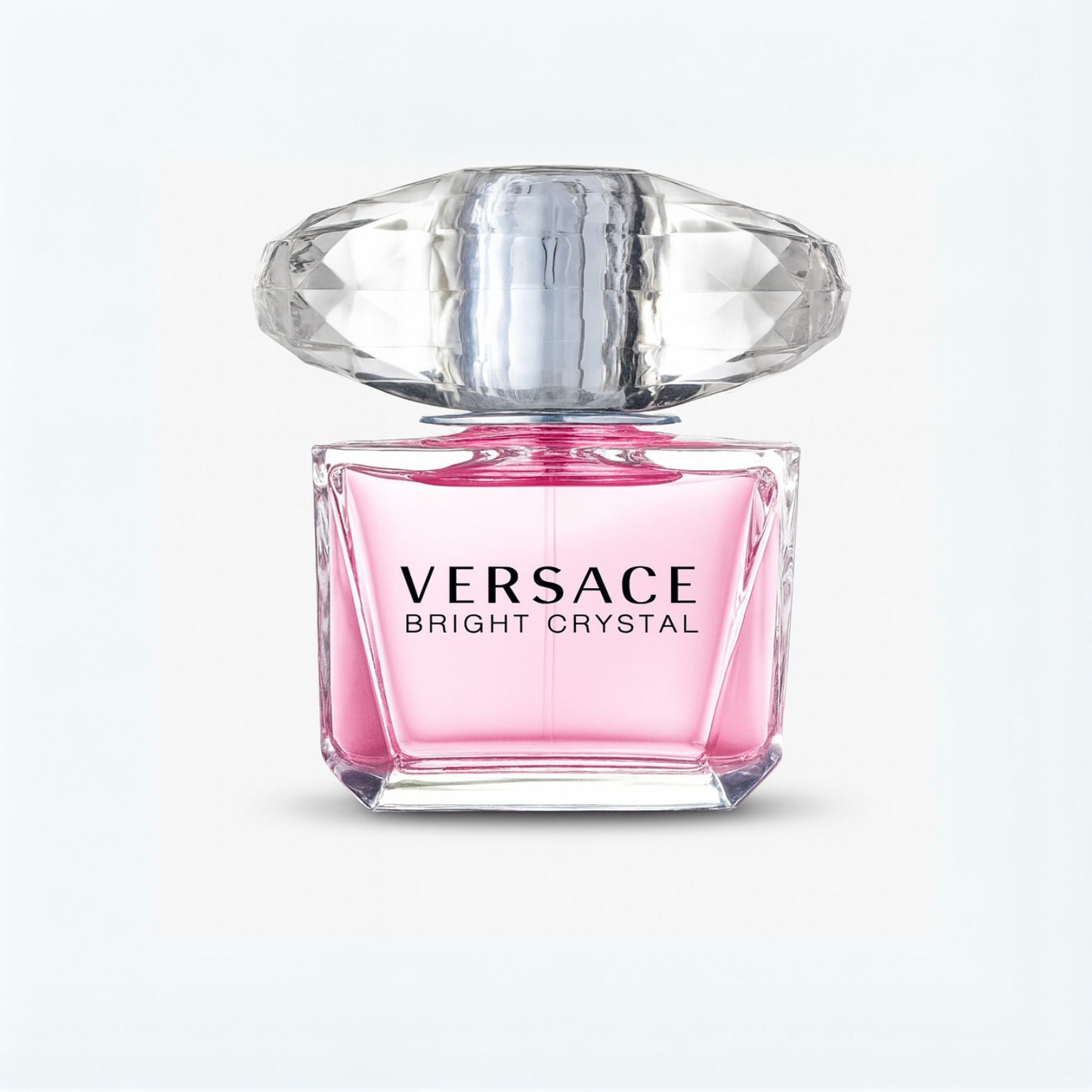 Versace Bright Crystal Eau de Toilette pink perfume bottle with crystal cap on a plain white background