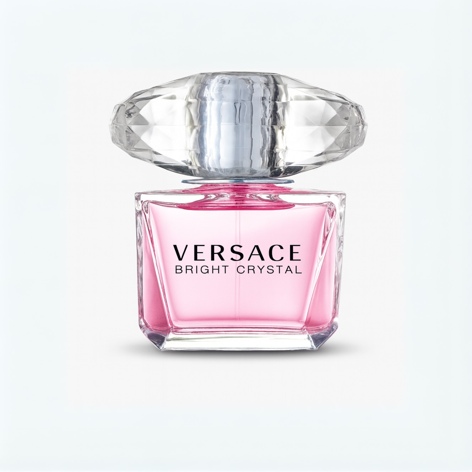 Versace Bright Crystal Eau de Toilette pink perfume bottle with crystal cap on a plain white background