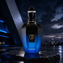 Xerjoff Avanguardia niche fragrance by Automobili Lamborghini and Xerjoff displayed on dark stone with modern city skyline and blue ambient lighting backdrop