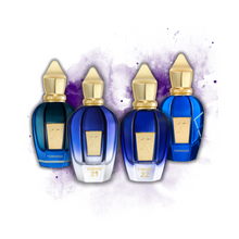 Xerjoff Torino Discovery Set with bottles of Torino 21, 22, 23, and 24 on a white and purple watercolor background