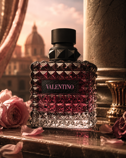 Valentino Donna Born In Roma Intense Eau de Parfum bottle in a luxurious Rome-inspired setting with pink roses and warm sunset lighting